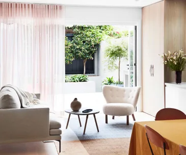 pink living room green sofa