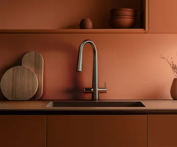 Amber coloured kitchen bench with sink and ZIP tap