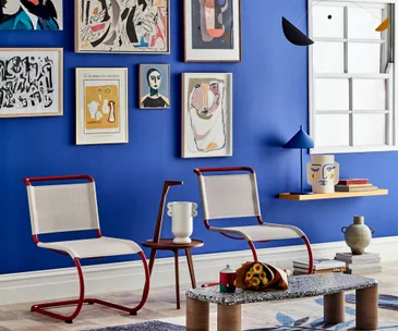 art gallery wall on blue wall