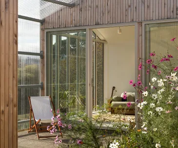A unique New Zealand home with a secret wildflower garden hidden inside