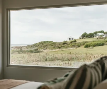 outdoor view from a waterfront beach house airbnb in tasmania