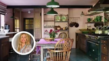 Sienna Miller cottage for sale pink kitchen with green aga.