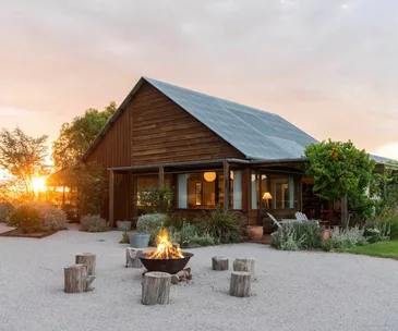A country home with a fire pit