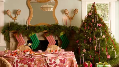 A living room with a Christmas tree and pieces from Bonnie + Neil