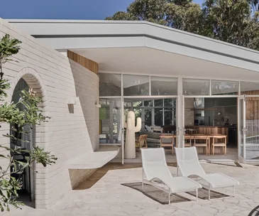 The white brick exterior of the architectural project 'Not a motel'