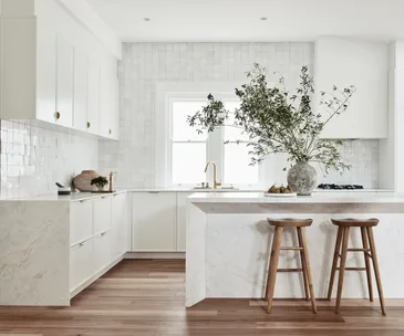 contemporary white kitchen with stone island