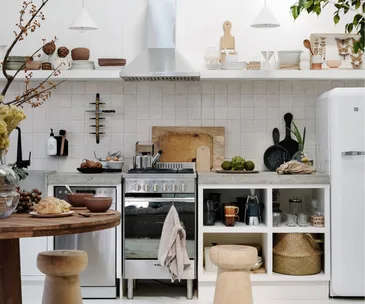 A white country kitchen with open shelving