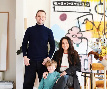 Artists Bobby and Steve Clark with son Jimmy in their home