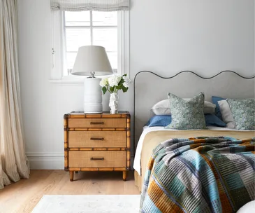 A Kate Walker-designed bedroom with a wavy headboard
