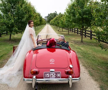 Bridge and groom with red MG