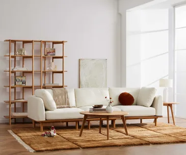 A white living room decorated with furniture from IconByDesign