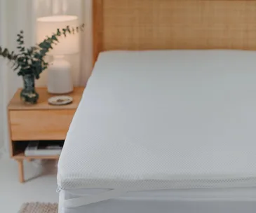 A close up of a mattress topper