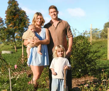 Tanya and Matteo Barbariol with sons Luca and Oscar at their garden patch on a friend’s property up the road