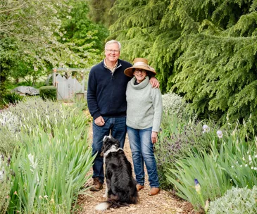 Ian and Sue Rogan, the owners of a tree farm in Millthorpe, with their dog