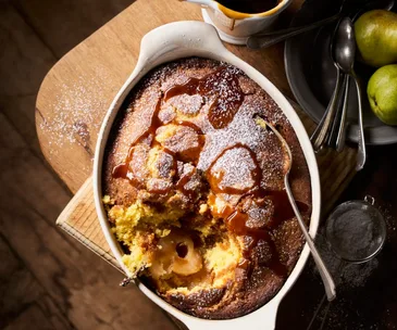 A pear sponge pudding drizzled with salted caramel sauce