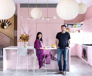 Australian creatives Carla and Nash in their bold pink kitchen