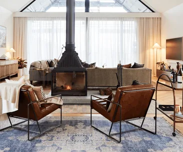 Tom and sarah-jane's living room with fireplace on The Block